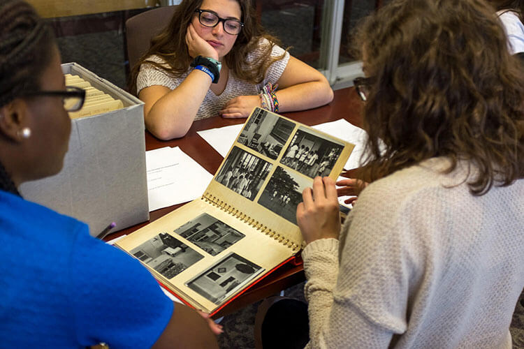 Students in Archives reviewing primary source materials