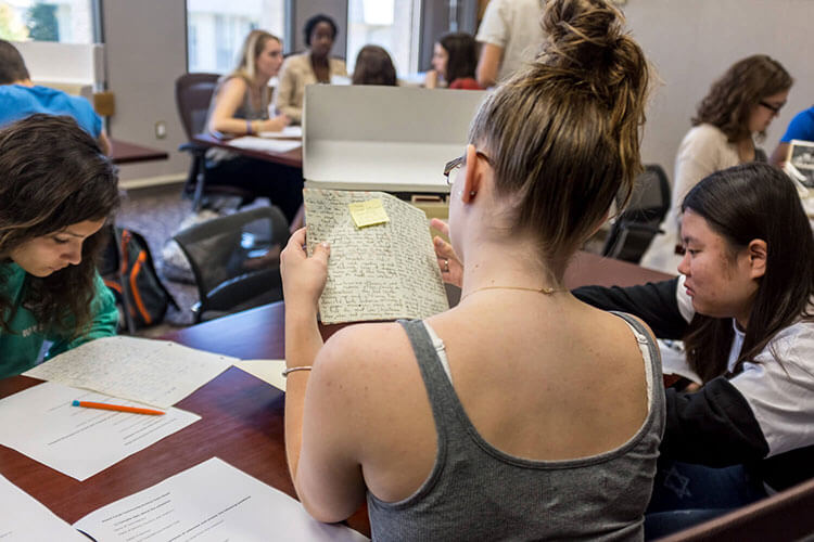Students in Archives reviewing primary source materials