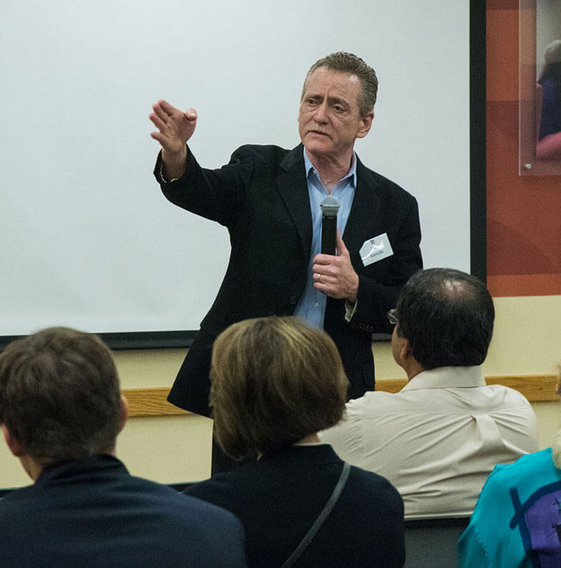 Bill Gentile taking questions at his presentation.