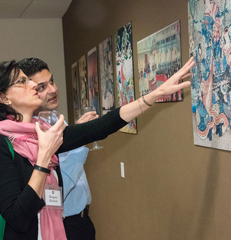 Attendees looking at reproductions of the donated woodblocks.